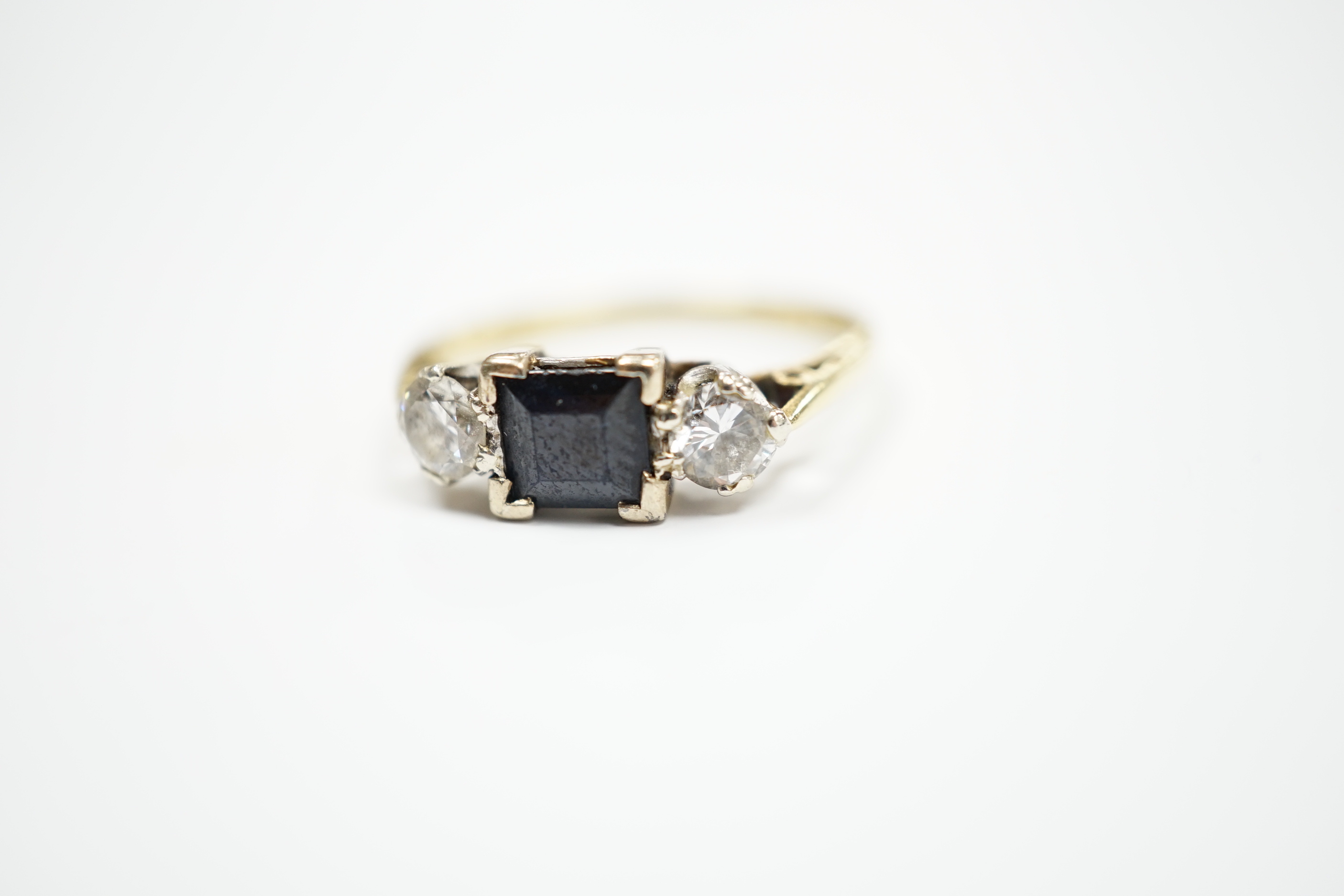 An 18ct gold, single stone sapphire and two stone diamond set ring, size O/P, gross weight 3.3 grams.